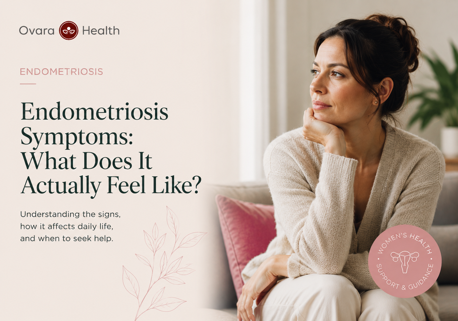 Thoughtful woman resting her chin on her hand on a sofa, weighing up endometriosis vs adenomyosis symptoms